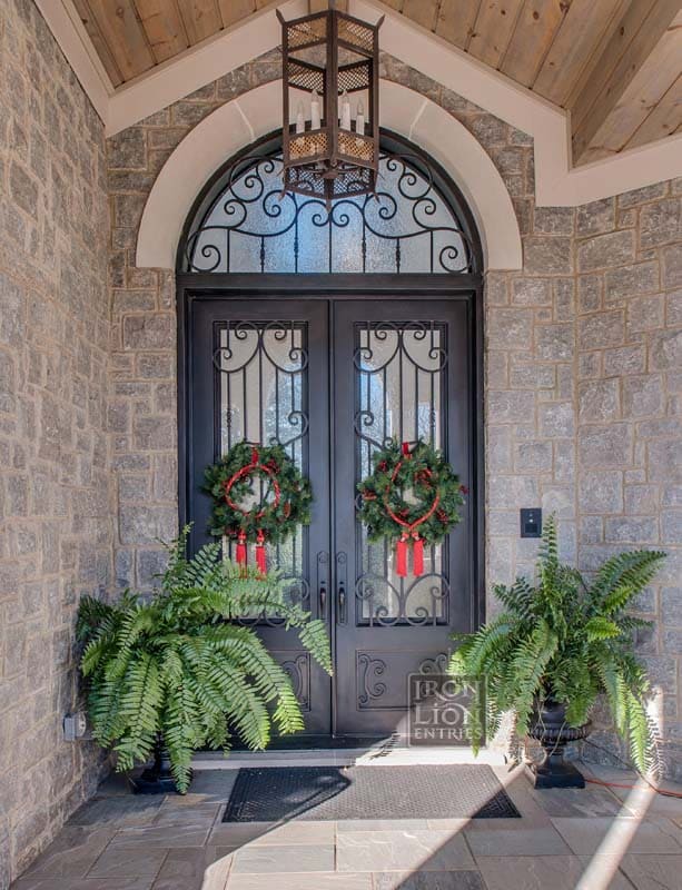 Classic wrought iron door with stunning iron scroll work. 