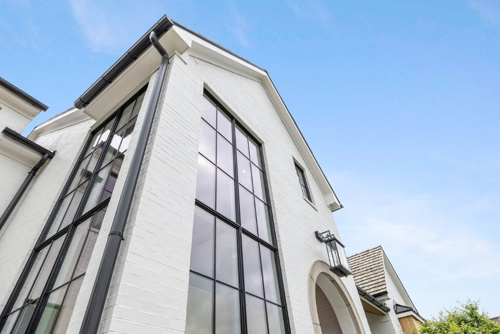 Upward shot of iron lion custom windows made of steel and insulated glass.